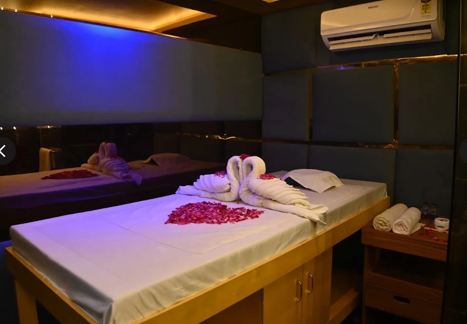 Massage bed prepared with rose petals